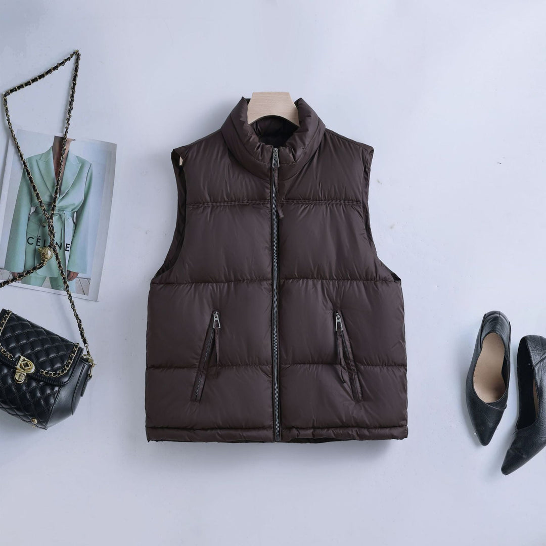 Women’s padded quilted vest with a high stand-up collar and two-way zipper