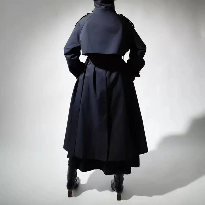 Women’s maxi-length trench coat with a high stand-up collar and waist belt