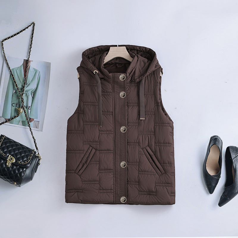 Women’s sleeveless quilted hooded vest with concealed button placket and welt pockets