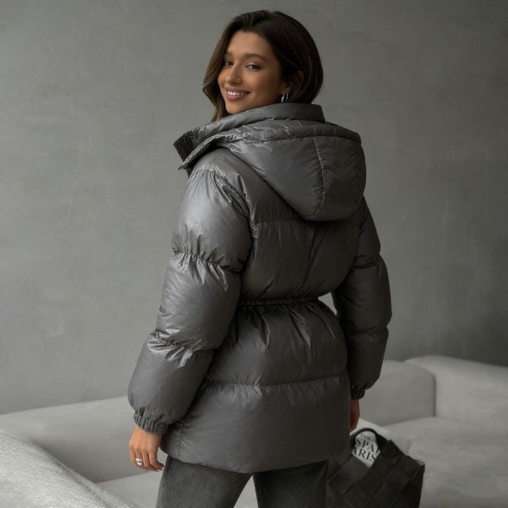 Women's hooded jacket with an adjustable waist drawstring and glossy finish