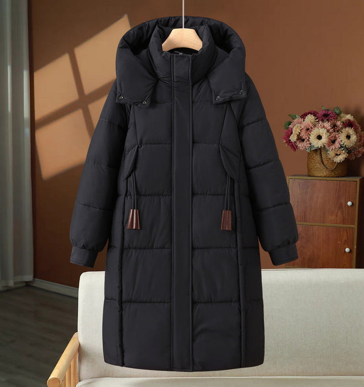 Women’s long padded hooded coat with a high stand-up collar and concealed zipper