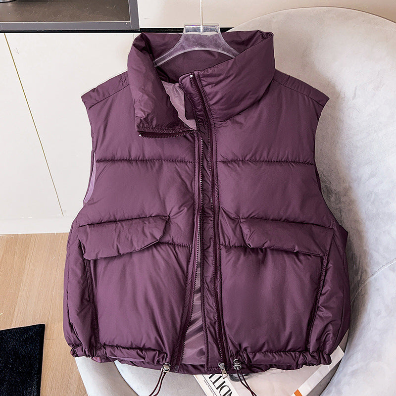 Women's short insulated microfiber quilted vest with a high stand-up collar and drawstring hem