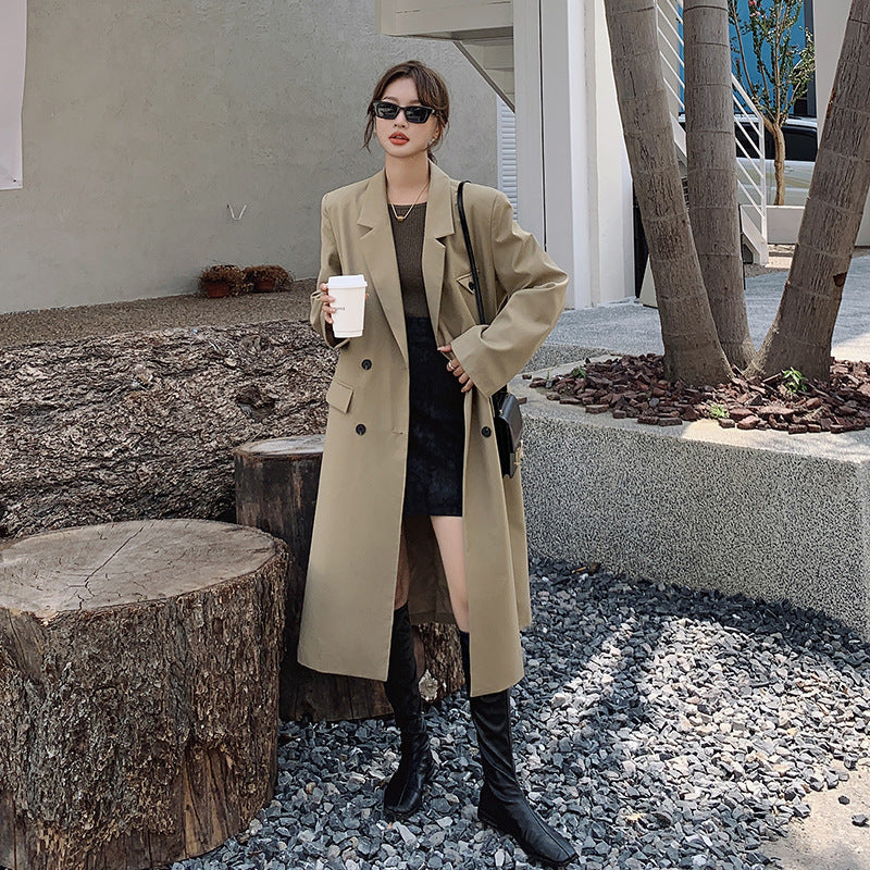 Women’s double-breasted oversized trench coat with lapels and an elongated cut