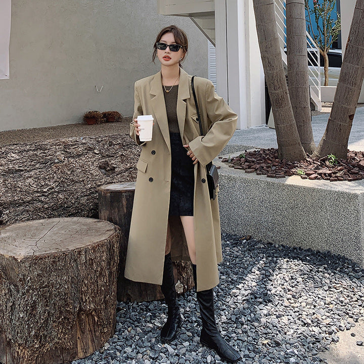 Women’s double-breasted oversized trench coat with lapels and an elongated cut