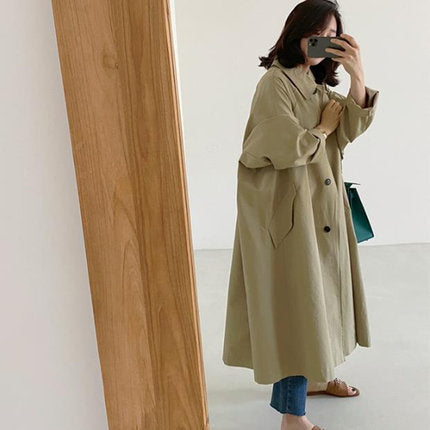 Women’s long swing coat with an A-line cut and dropped shoulders