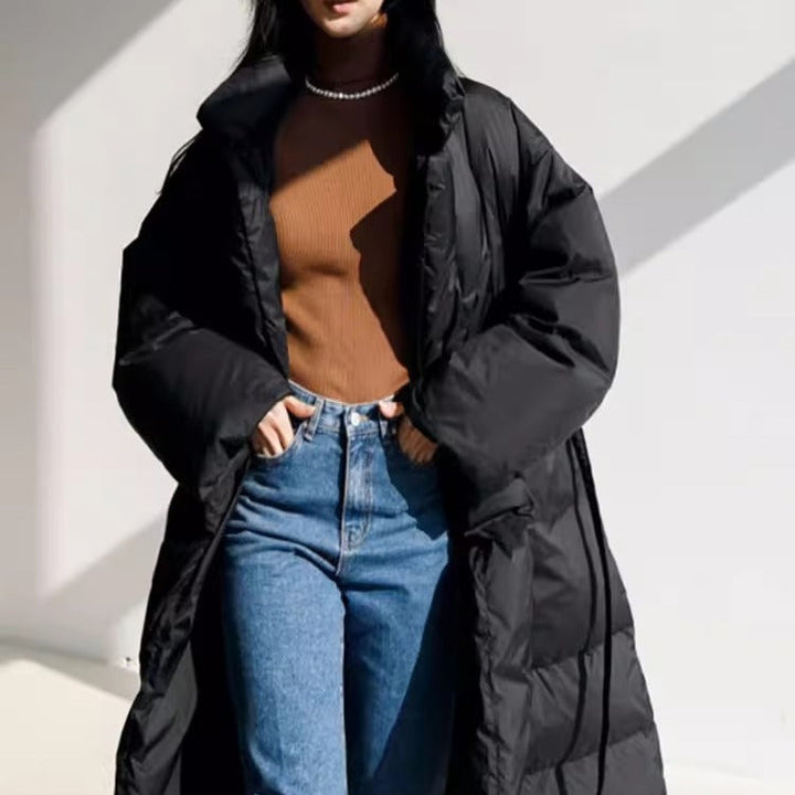 Women’s longline parka with a wrap belt and voluminous sleeves
