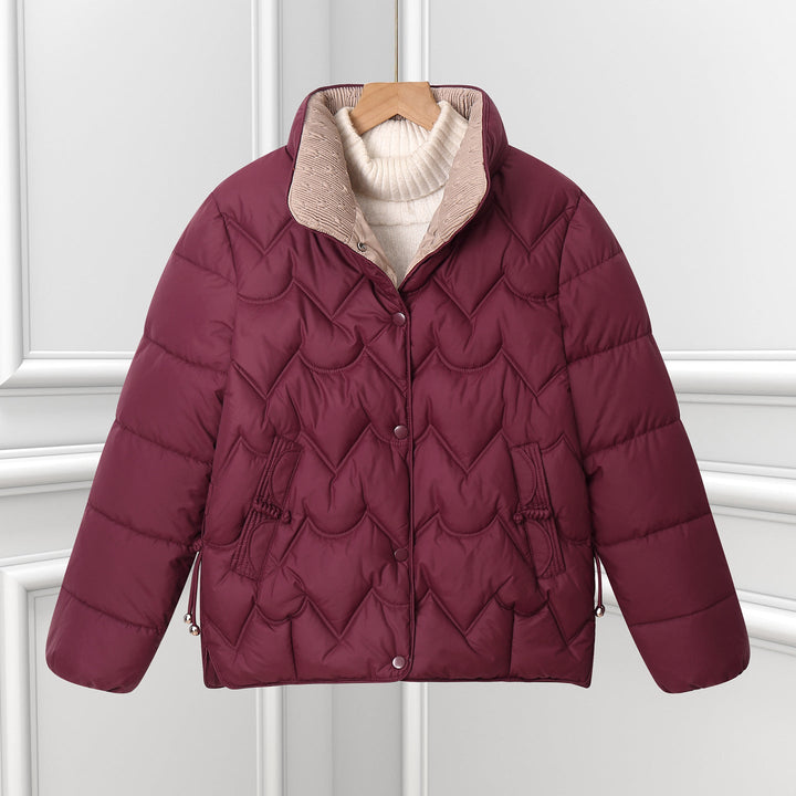 Women’s short quilted jacket with curved quilting and snap-button placket