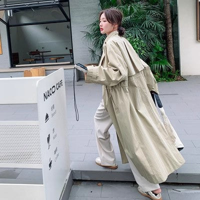 Women’s oversized trench coat with cape back and drawstring waist