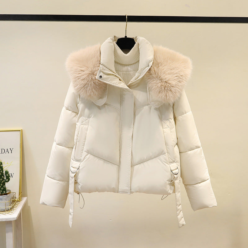 Women’s short quilted puffer jacket with a voluminous faux-fur collar and waist belt