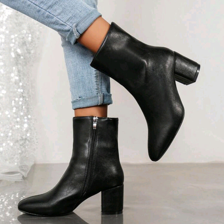 Women's ankle boots with a block heel and practical zipper