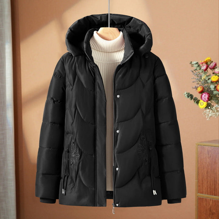 Women’s quilted thermal outdoor jacket with a hood and floral pocket embroidery