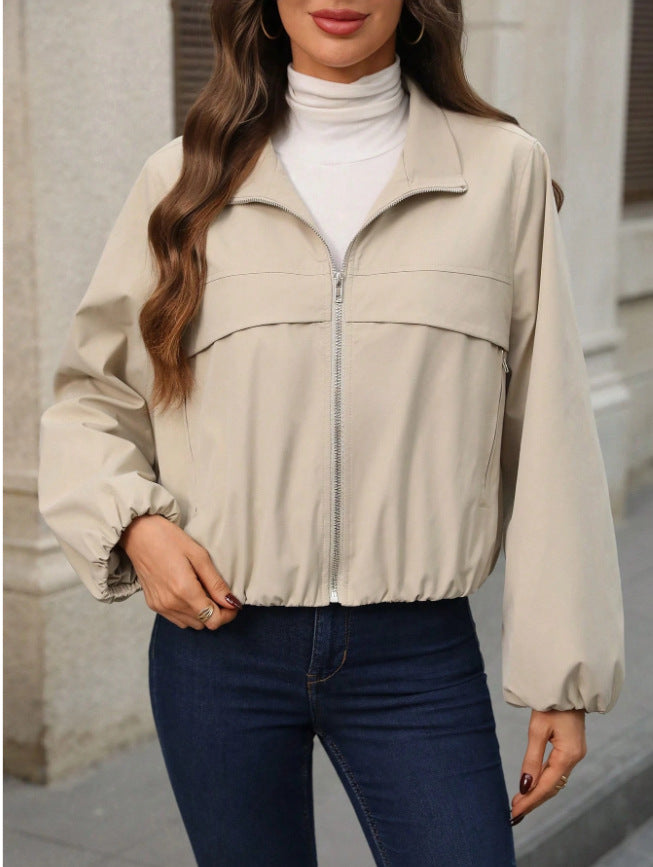 Women's cropped faux leather jacket with zippered pockets and a fitted cut
