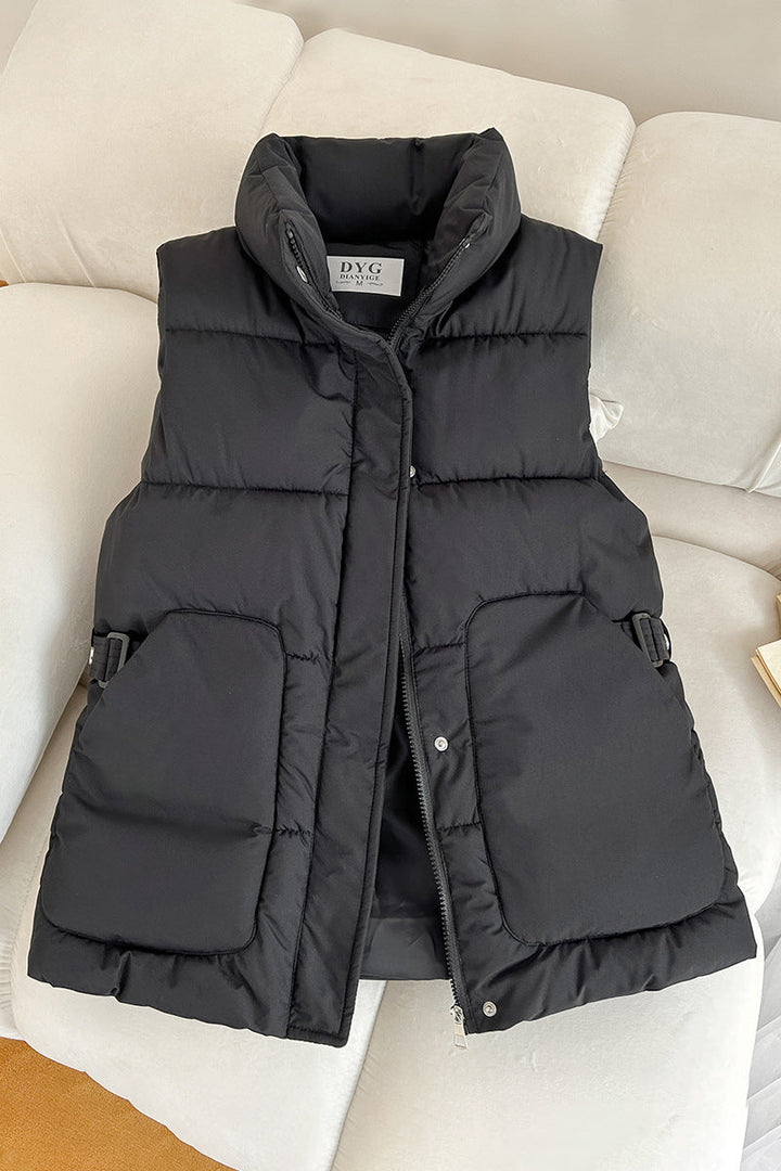 Women’s padded utility vest with stand-up collar and large flap pockets