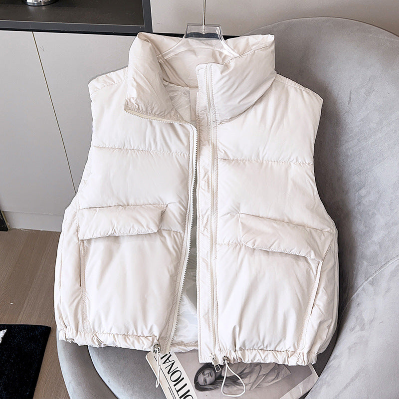 Women's short insulated microfiber quilted vest with a high stand-up collar and drawstring hem