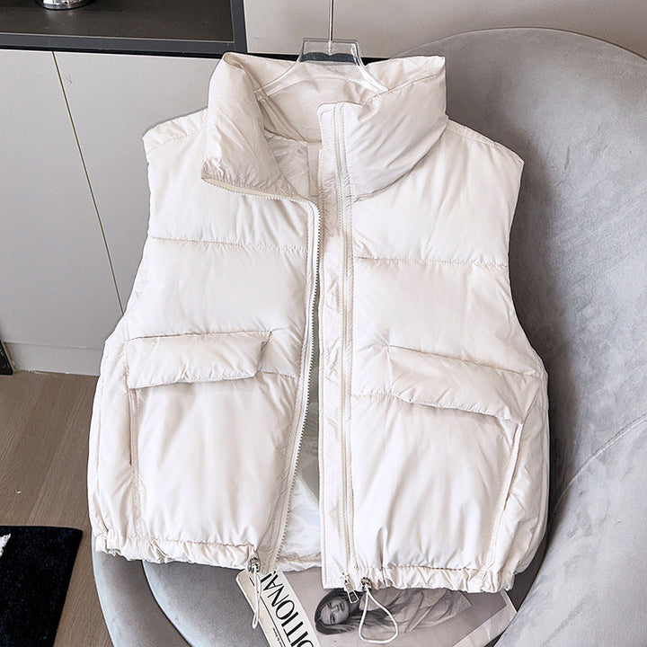 Women's short insulated microfiber quilted vest with a high stand-up collar and drawstring hem