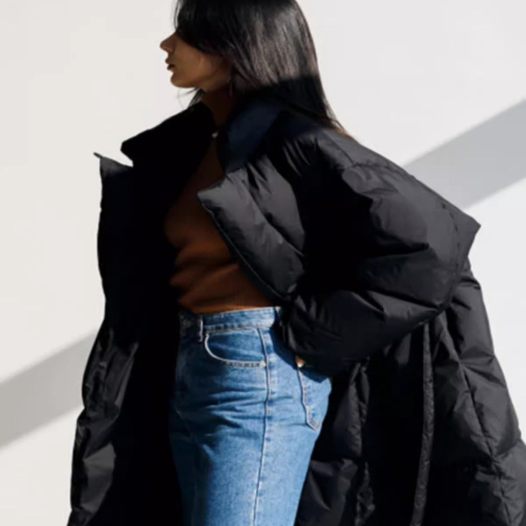 Women’s longline parka with a wrap belt and voluminous sleeves