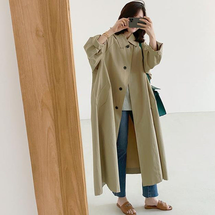 Women’s long swing coat with an A-line cut and dropped shoulders