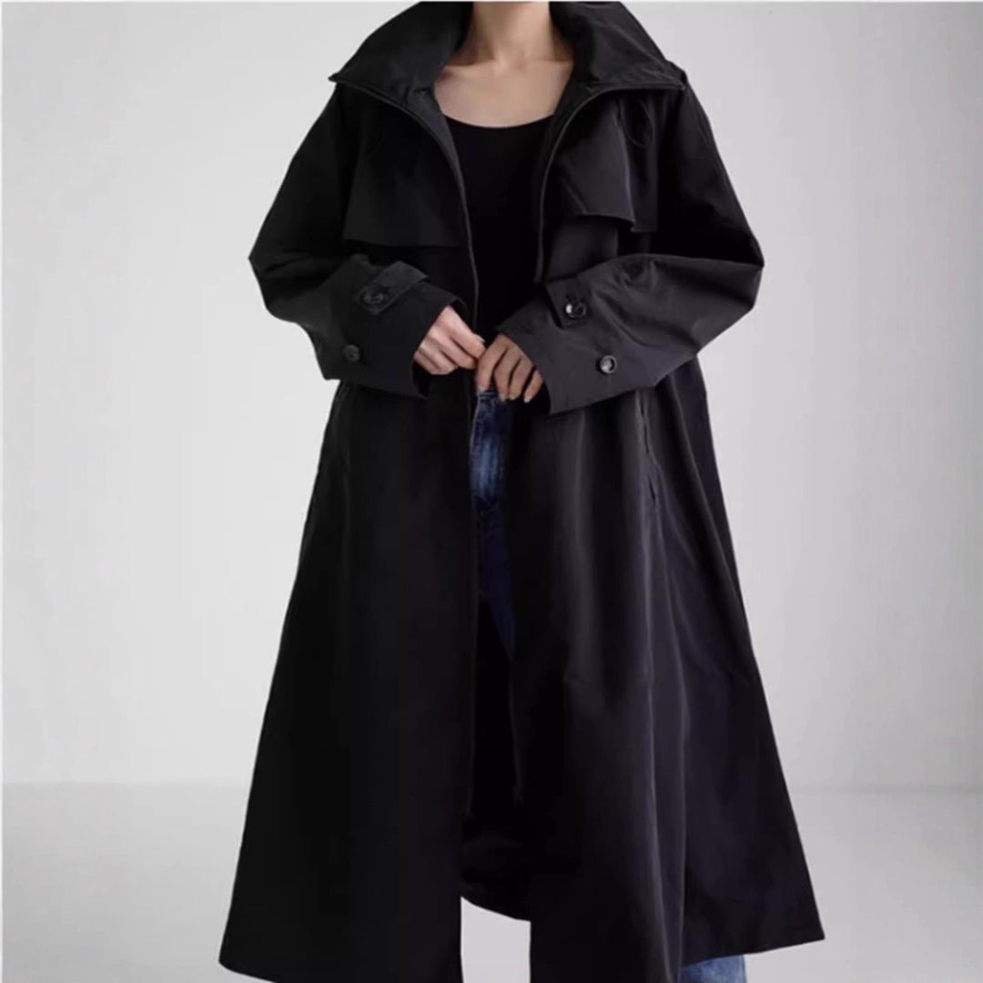 Women’s water-repellent oversized raincoat with hood and A-line silhouette