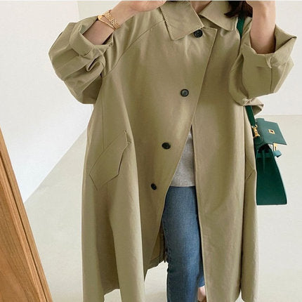 Women’s long swing coat with an A-line cut and dropped shoulders