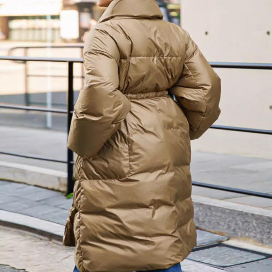Women’s longline parka with a wrap belt and voluminous sleeves