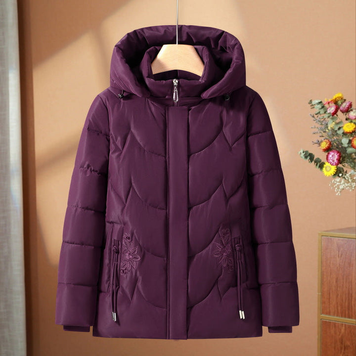 Women’s quilted thermal outdoor jacket with a hood and floral pocket embroidery