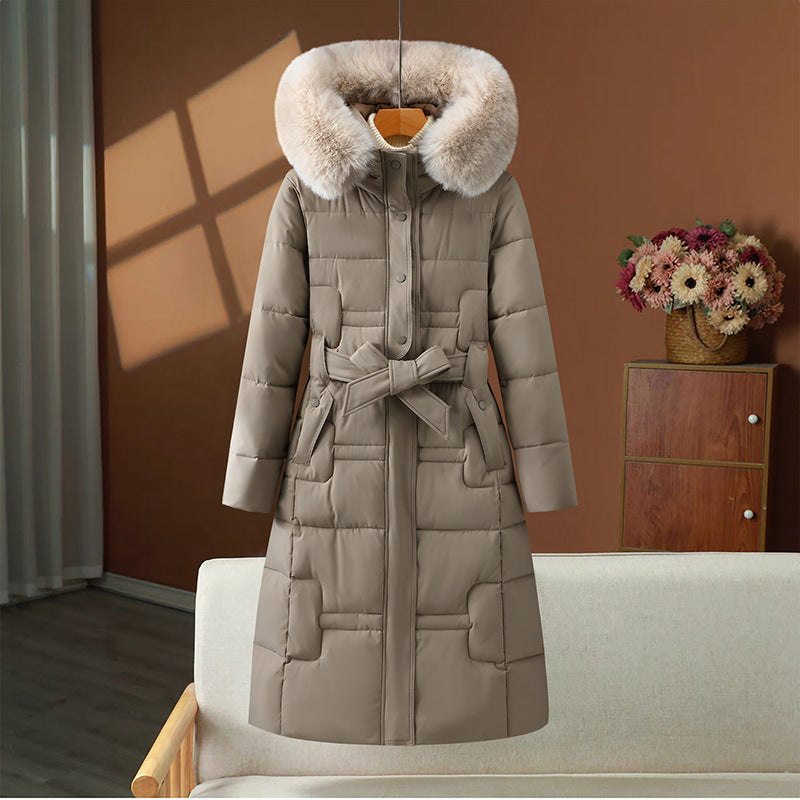 Women’s long quilted winter coat with detachable faux-fur collar and waist belt