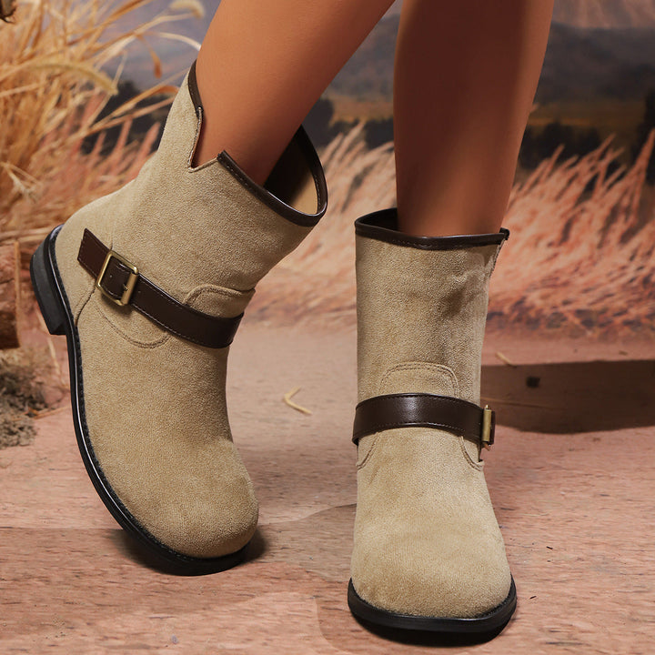 Women's ankle boots with a V-cut, strap, and buckle