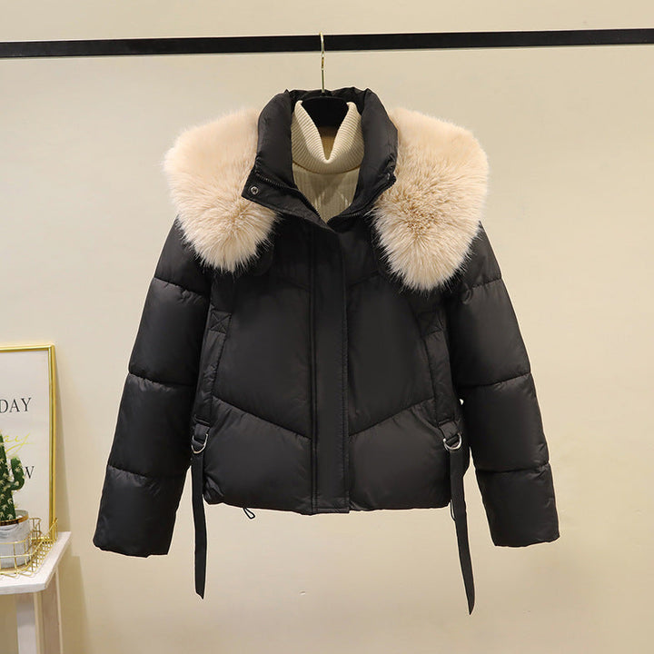 Women’s short quilted puffer jacket with a voluminous faux-fur collar and waist belt