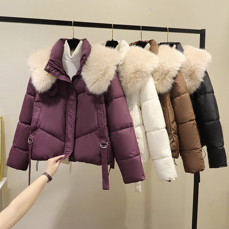 Women’s short quilted puffer jacket with a voluminous faux-fur collar and waist belt
