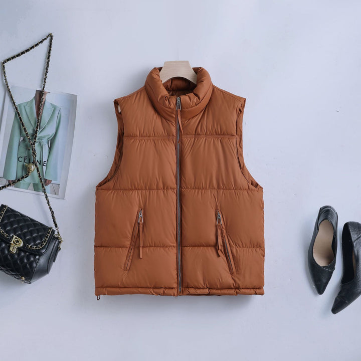 Women’s padded quilted vest with a high stand-up collar and two-way zipper