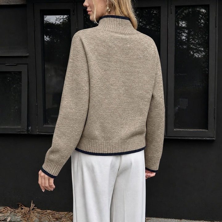 Women's sweater with a stand-up collar, contrasting cuffs, and a relaxed fit