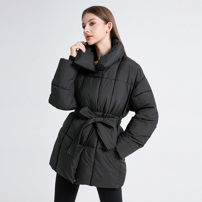 Women's fitted quilted coat with a tie belt and high shawl collar