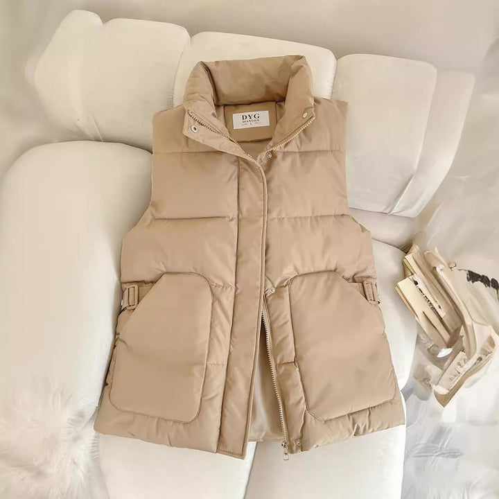 Women’s padded utility vest with stand-up collar and large flap pockets