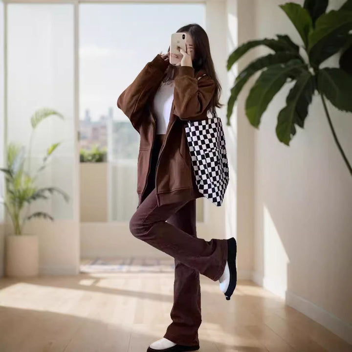 Women's oversized hooded jacket with zipper, kangaroo pockets, and ribbed cuffs