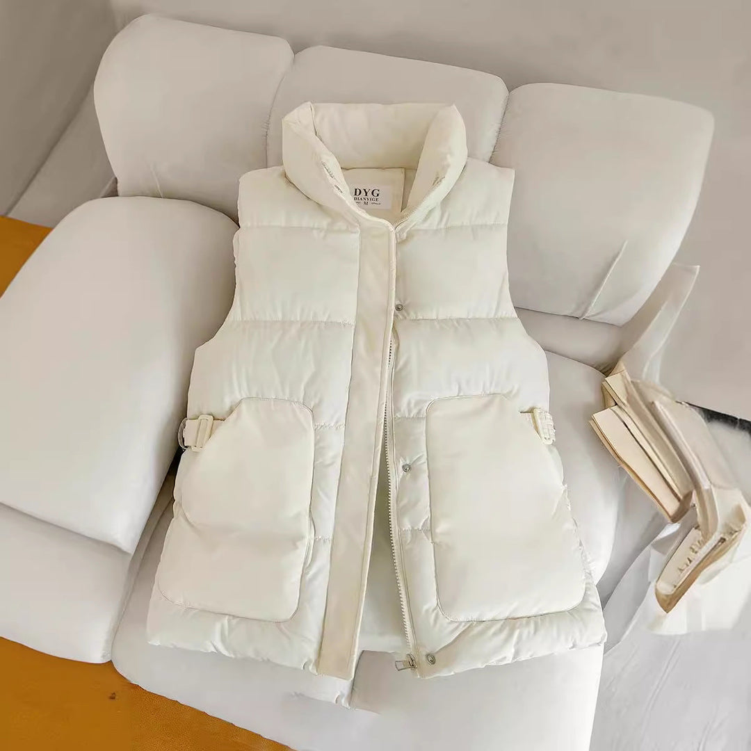 Women’s padded utility vest with stand-up collar and large flap pockets