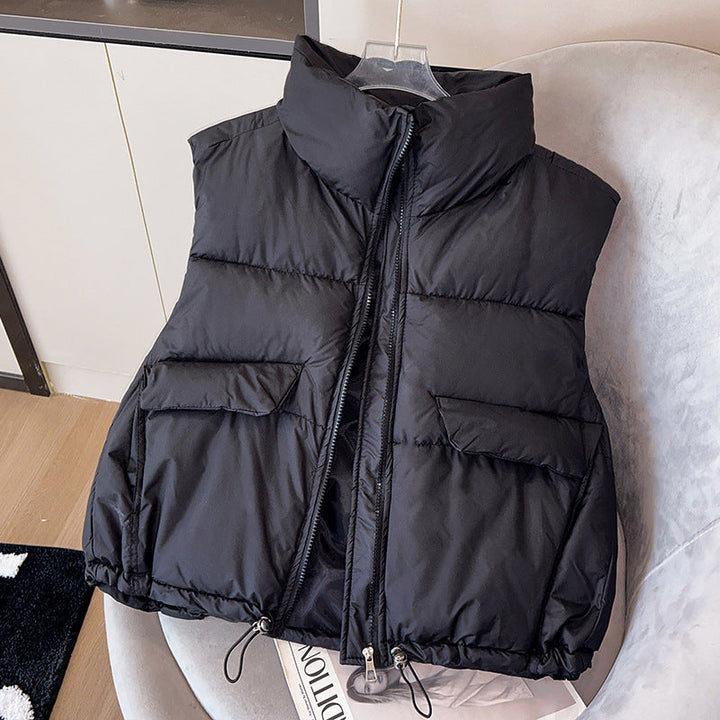 Women's short insulated microfiber quilted vest with a high stand-up collar and drawstring hem