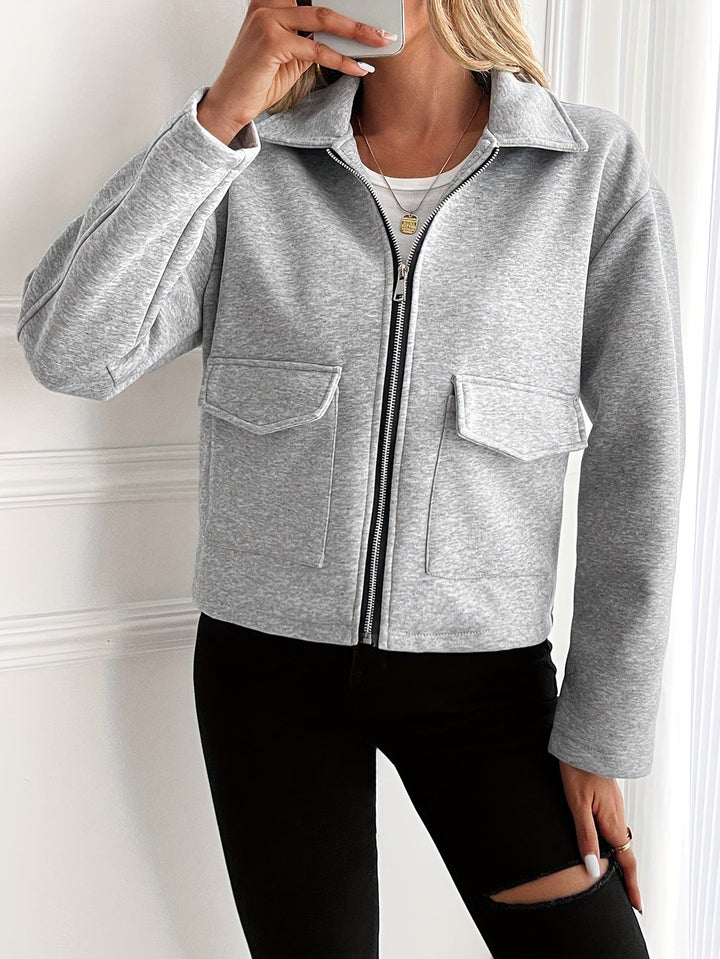 Women's fleece jacket with a zipper and flap pockets