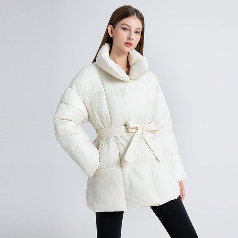 Women's fitted quilted coat with a tie belt and high shawl collar