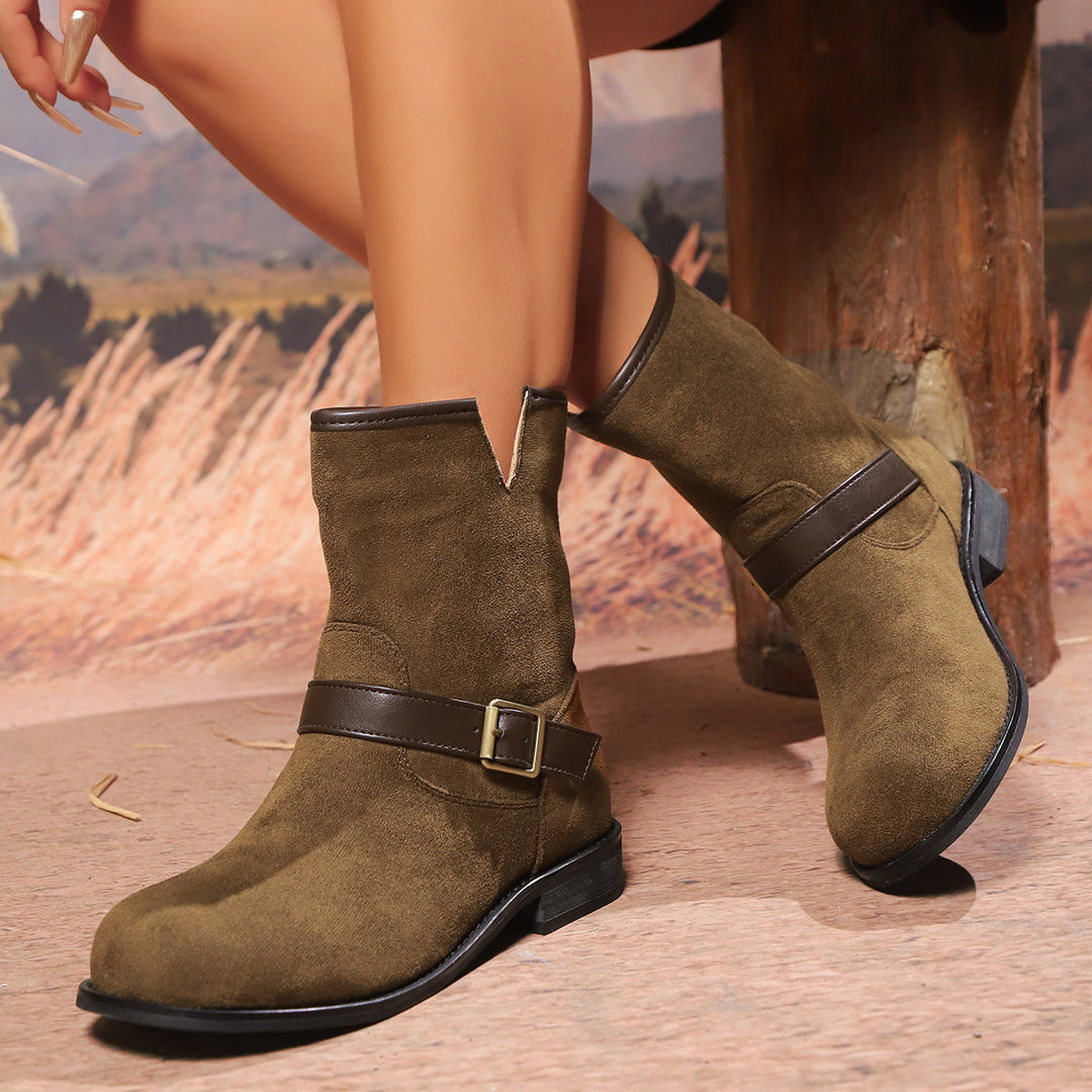 Women's ankle boots with a V-cut, strap, and buckle