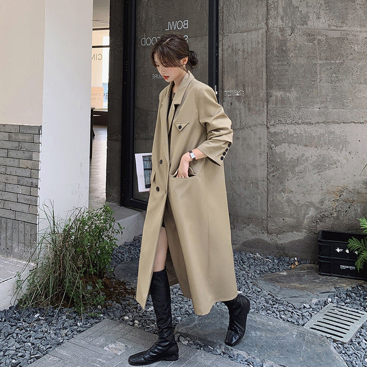 Women’s double-breasted oversized trench coat with lapels and an elongated cut