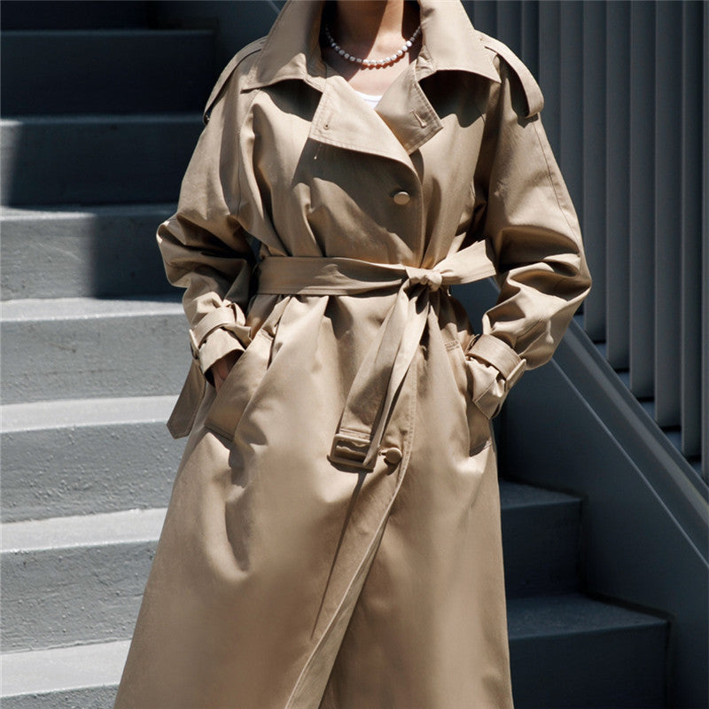 Women’s oversized trench coat with storm flap and detachable tie belt