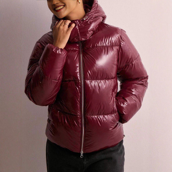 Women's quilted jacket with an adjustable hood and zippered pockets