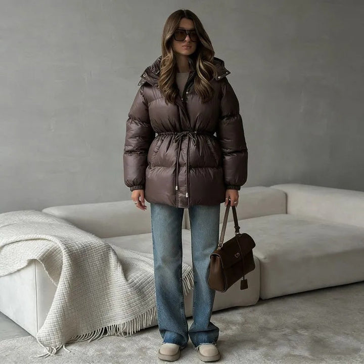 Women's hooded jacket with an adjustable waist drawstring and glossy finish