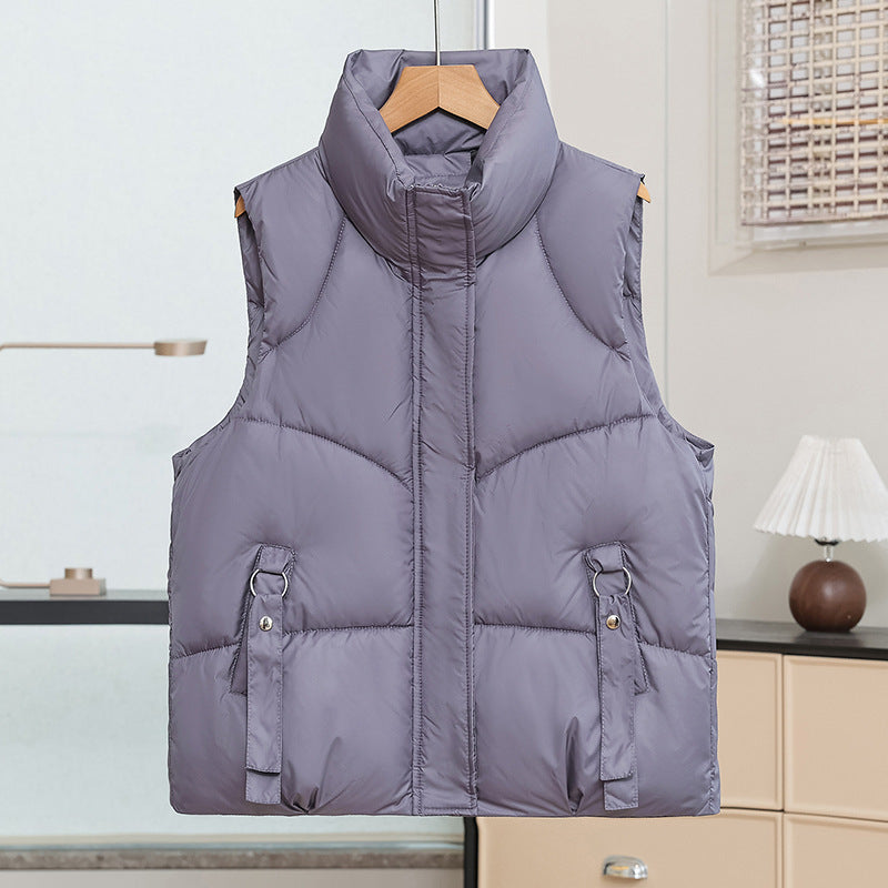 Women's padded quilted vest with a high stand-up collar and decorative ring loops