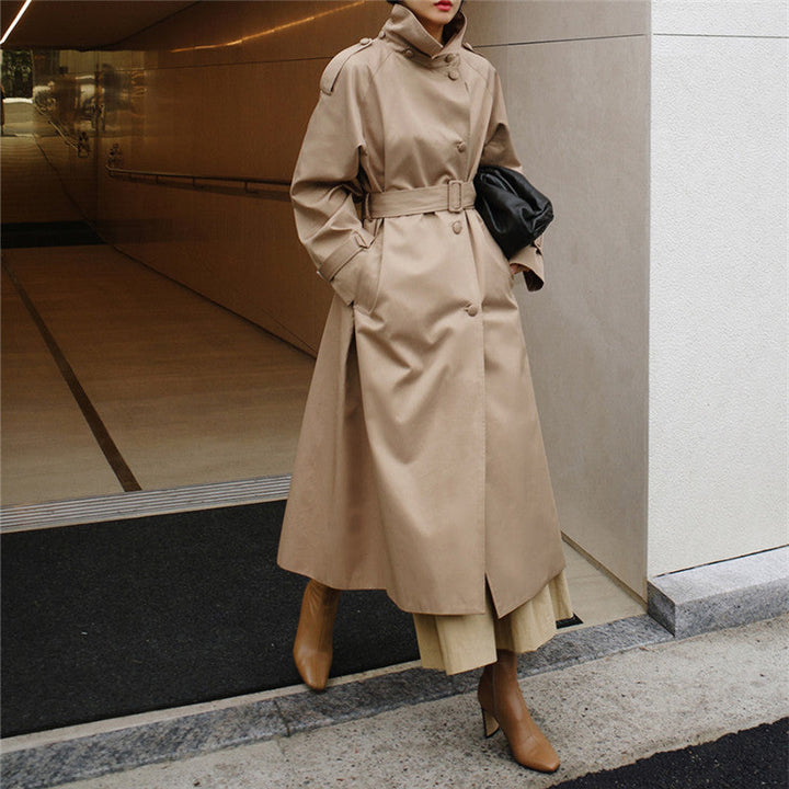 Women's long trench coat with waist belt and high stand-up collar