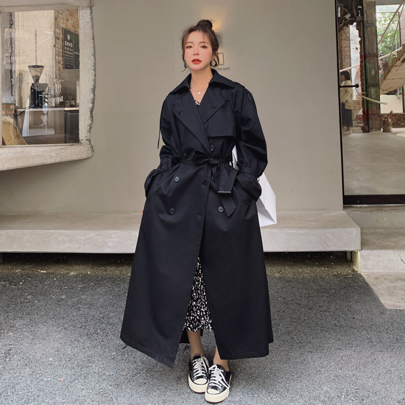 Women's oversized trench coat with double-breasted button fastening and storm flap