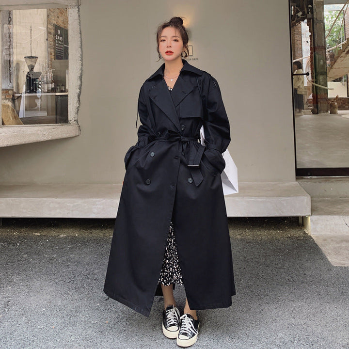 Women's oversized trench coat with double-breasted button fastening and storm flap