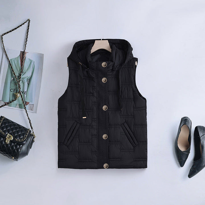 Women’s sleeveless quilted hooded vest with concealed button placket and welt pockets