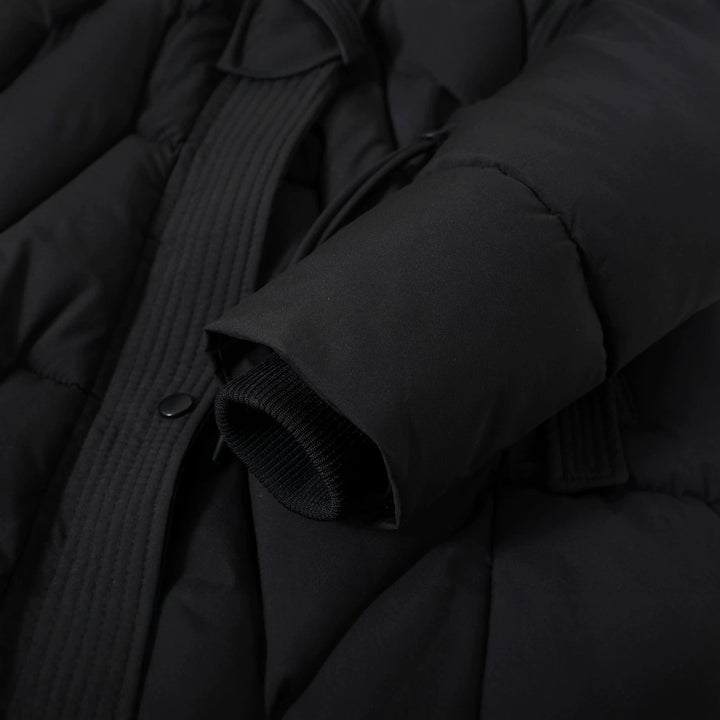 Women's long quilted parka with a faux-fur hood and drawstring