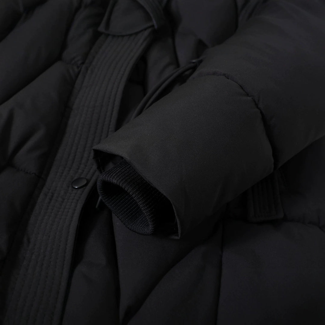 Women's long quilted parka with a faux-fur hood and drawstring